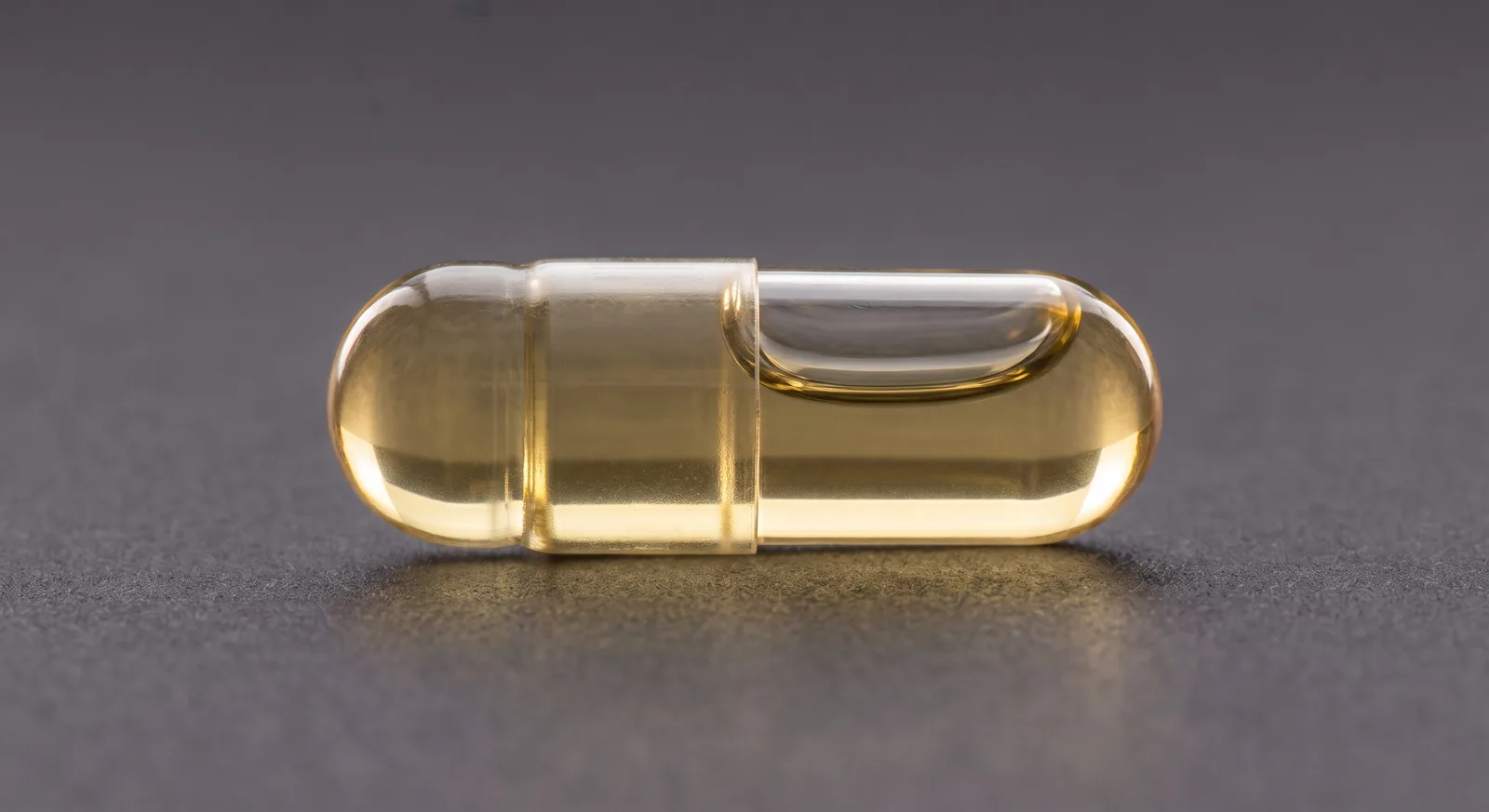 A sealed transparent capsule containing liquid.