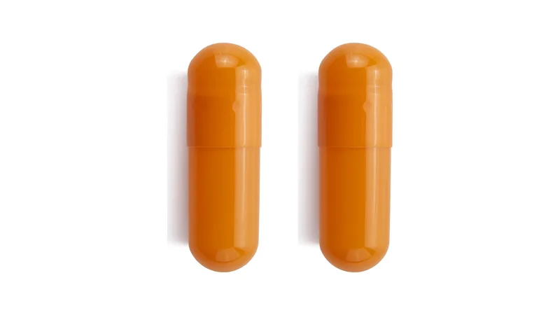 Two similar orange capsules side by side on a white background.